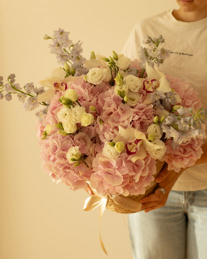L size basket with hydrangeas, lisianthus, delphinium and orchids