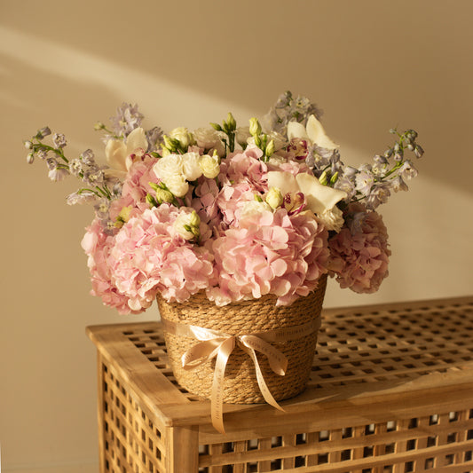 L size basket with hydrangeas, lisianthus, delphinium and orchids