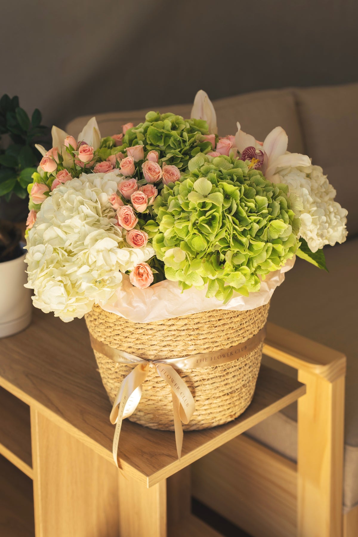 L size basket with hydrangeas, spray roses and orchids